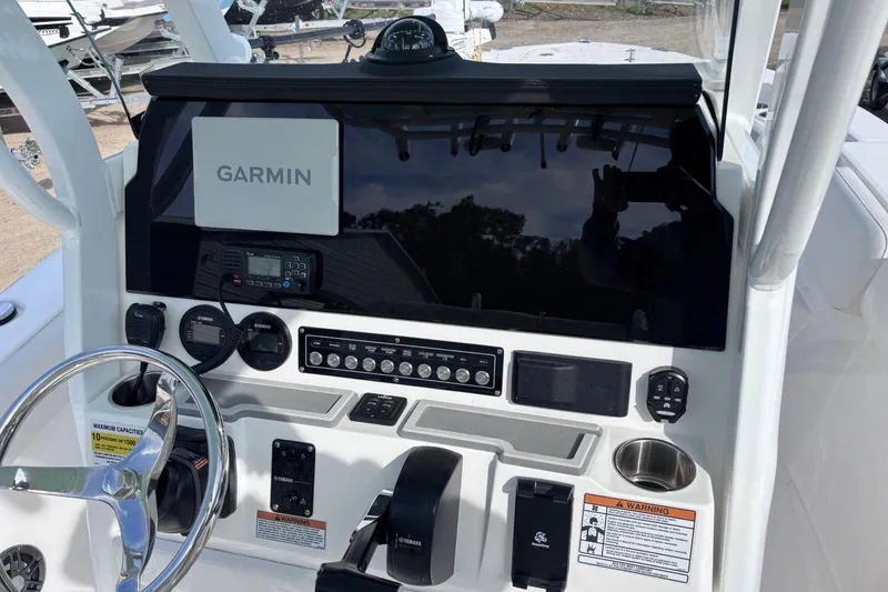 Slide: The Image of 2025 Sea Fox 228 Commander boat dashboard with Garmin navigation system and controls. - 3