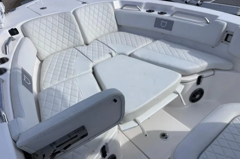 Slide: The Image of Luxurious seating on 2025 Sea Fox 228 Commander boat with quilted white upholstery. - 4