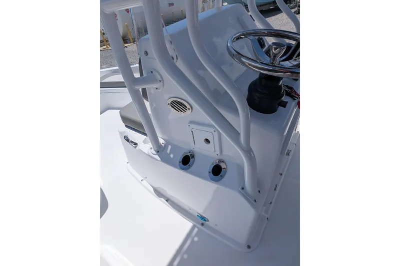 Slide: The Image of 2026 Clearwater 21 Bay boat console with steering wheel and rod holders. - 9