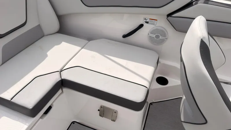 Slide: The Image of The interior of the 2026 Yamaha AR220 features white upholstery with gray accents and a speaker. - 19