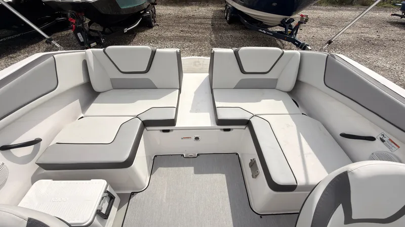 Slide: The Image of The image shows the interior of a Yamaha AR220 boat with gray and white seating. - 13