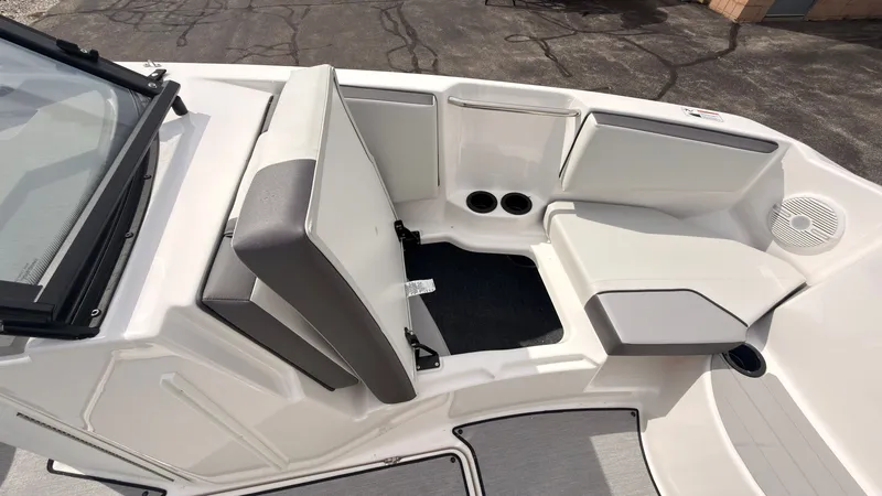 Slide: The Image of The 2026 Yamaha AR220 features a modern, gray interior with comfortable seating and cup holders. - 36