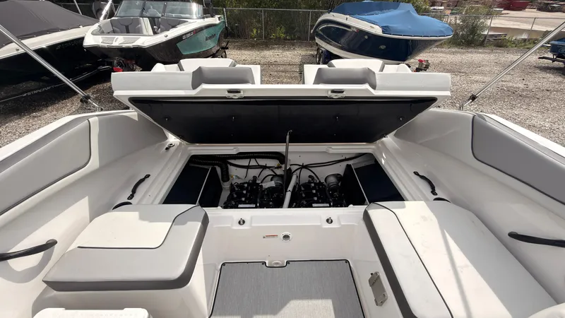Slide: The Image of The image shows the cockpit of a Yamaha AR220 boat with an open engine compartment. - 14