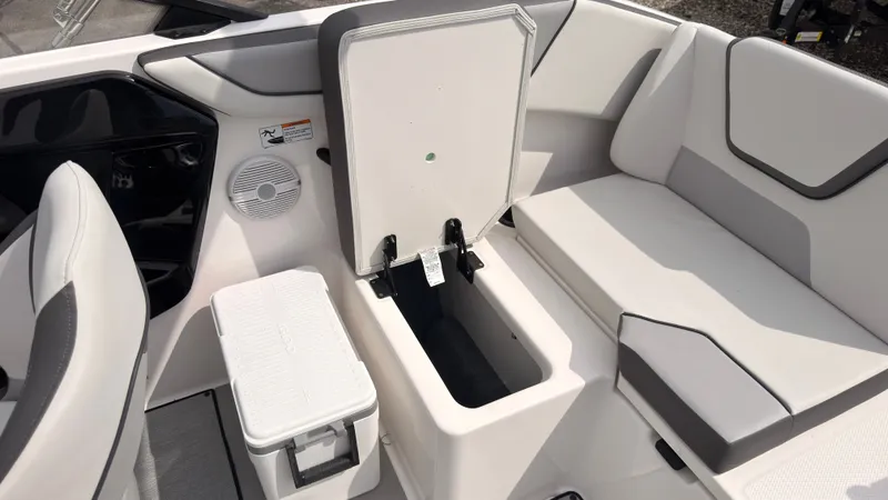 Slide: The Image of Interior of a Yamaha AR220 boat with seating and storage compartment. - 18