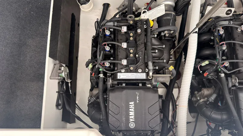 Slide: The Image of Yamaha AR220 2026 engine compartment with a clean, modern engine and wiring. - 16