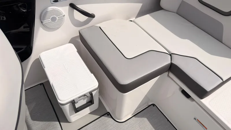 Slide: The Image of Interior of the Yamaha AR220 with gray upholstery and a white cooler. - 17