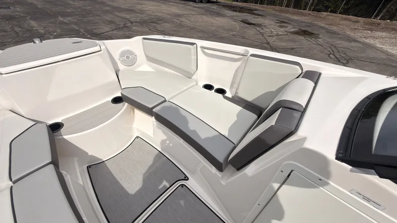 Slide: The Image of The image shows the bow area of a Yamaha AR220 boat with cushioned seating and cup holders. - 38