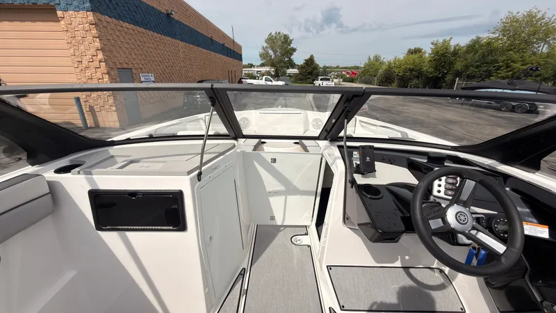 Slide: The Image of The image shows the cockpit of a 2026 Yamaha AR220 boat with modern controls. - 33