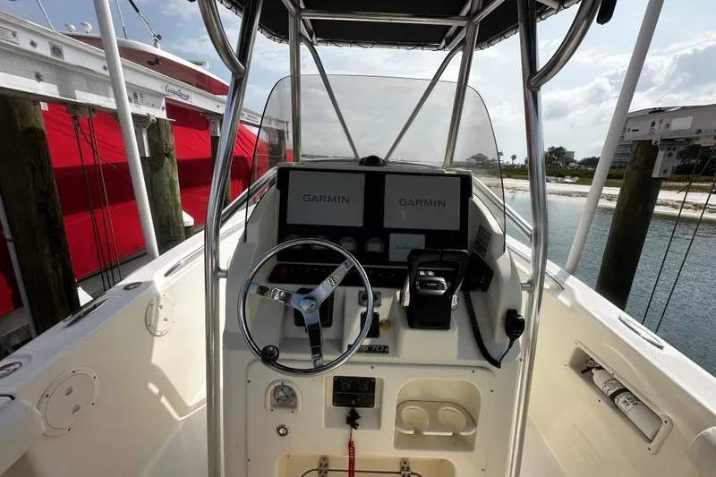 Slide: The Image of 2006 Pursuit 2570 Center Console boat with Garmin navigation system at the helm. - 6
