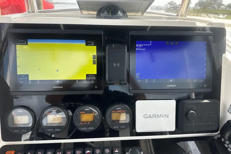 Slide: The Image of Dashboard of a 2006 Pursuit 2570 Center Console with Garmin navigation displays. - 7