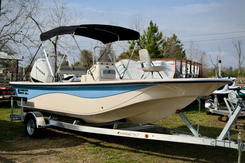 The Image of 2026 Carolina Skiff 21 LS boat on trailer, featuring Honda outboard motor. - 0