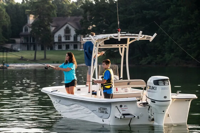 Slide: The Image of Manufacturer Provided Image: 2026 Carolina Skiff 21 LS boat with people fishing on a calm lake. - 10