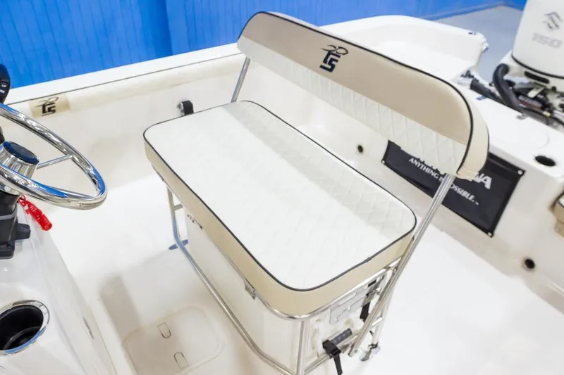 Slide: The Image of Manufacturer Provided Image: 2026 Carolina Skiff 21 LS boat interior with cushioned seating and steering wheel. - 11