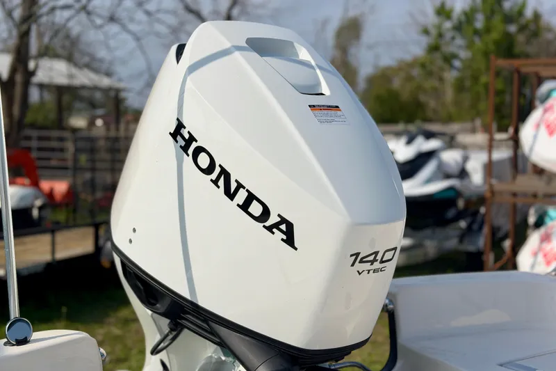 Slide: The Image of Honda 140 VTEC outboard motor on 2026 Carolina Skiff 21 LS boat. - 4