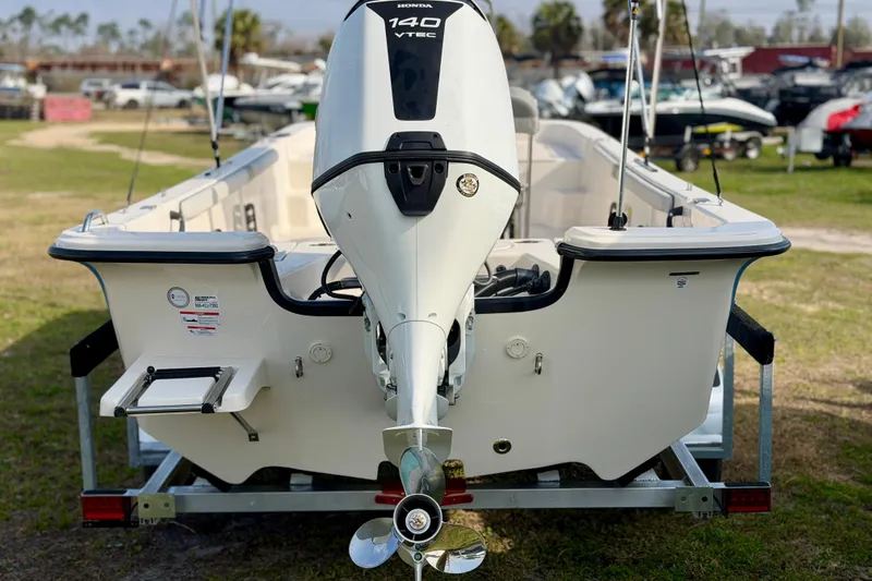 Slide: The Image of 2026 Carolina Skiff 21 LS boat with Honda 140 VTEC outboard motor on trailer. - 5