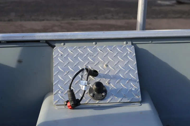 Slide: The Image of 2016 Smoker Craft Alaskan 15 boat interior with metal panel and wiring. - 12