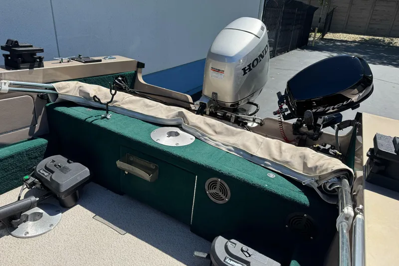 Slide: The Image of 2000 Lund 1600 Pro Sport boat with Honda and Mercury outboard motors. - 12