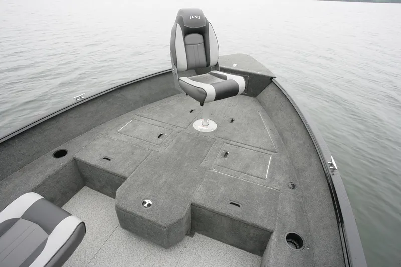 Slide: The Image of Manufacturer Provided Image: 2018 Lund 1650 Rebel XS Tiller boat interior with seating and storage compartments. - 4