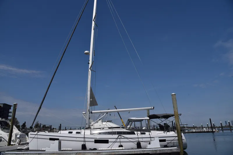 The Image of 2023 Catalina 425 sailboat docked at marina under clear blue sky. - 0