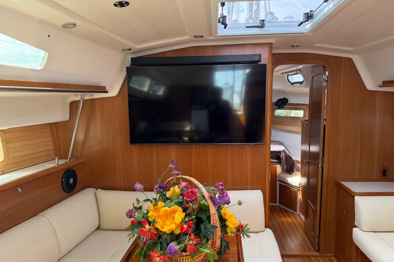 Slide: The Image of Luxurious interior of 2023 Catalina 425 yacht with TV and floral arrangement. - 15