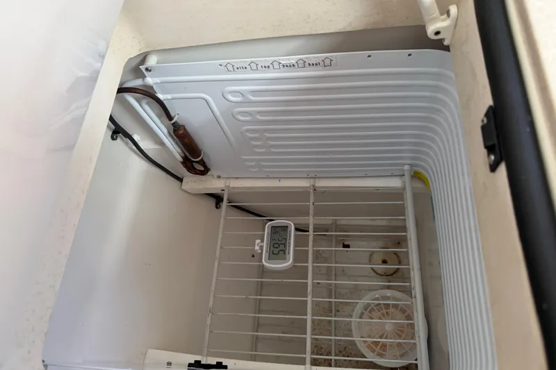 Slide: The Image of Interior of a Catalina 425 refrigerator, showing temperature gauge and cooling elements. - 20