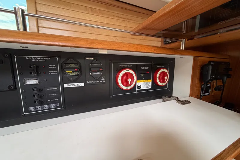 Slide: The Image of Electrical control panel on 2023 Catalina 425 yacht, featuring switches and battery selectors. - 26
