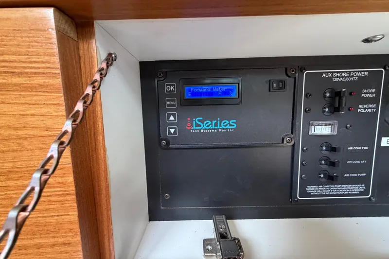 Slide: The Image of Control panel of a 2023 Catalina 425 yacht, featuring iSeries tank systems monitor. - 27
