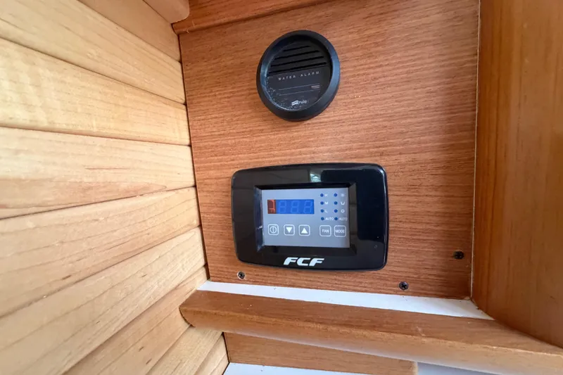 Slide: The Image of Control panel and water alarm on 2023 Catalina 425 yacht interior. - 29
