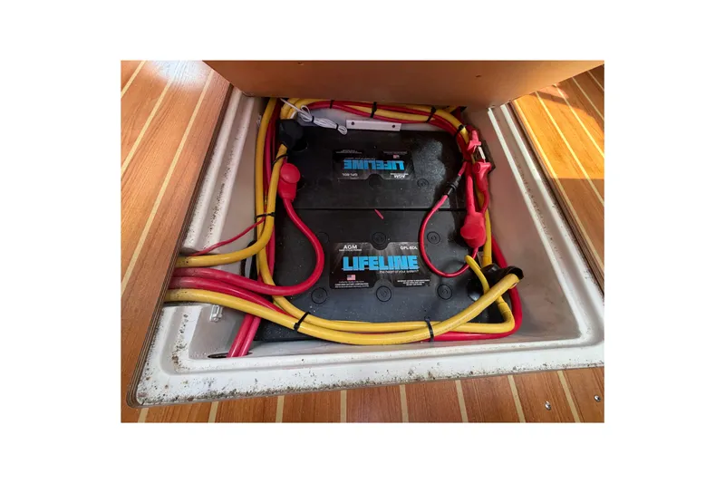 Slide: The Image of Battery compartment of 2023 Catalina 425 yacht with Lifeline AGM batteries and colorful wiring. - 30