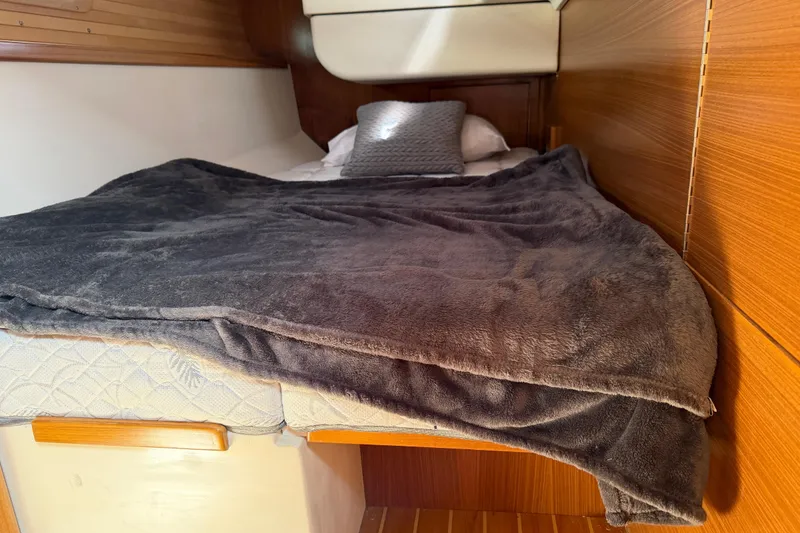 Slide: The Image of Cozy cabin bed in 2023 Catalina 425 yacht with plush blanket and pillow. - 31