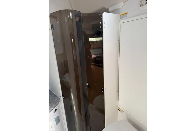 Slide: The Image of Interior of 2023 Catalina 425 yacht, featuring a sleek, modern bathroom design. - 34