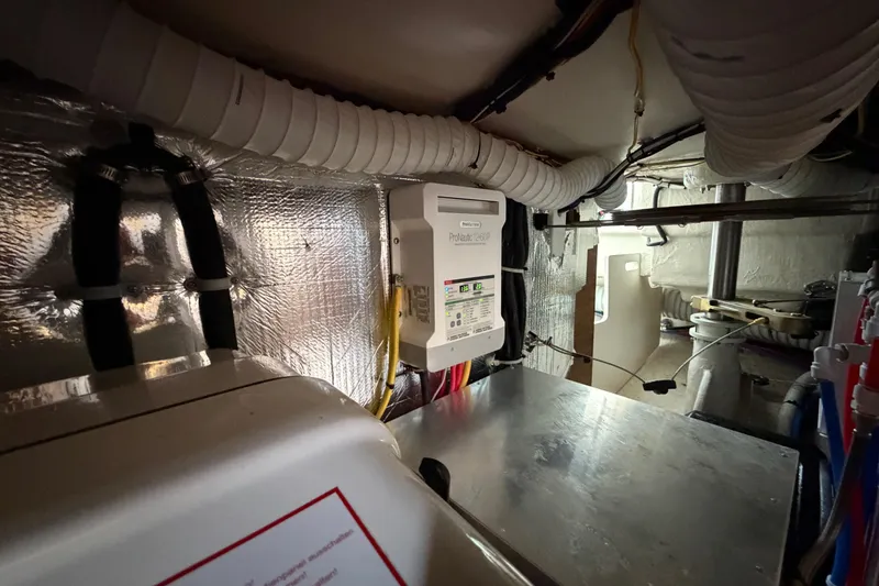 Slide: The Image of Engine room of 2023 Catalina 425 yacht with electrical panel and ventilation system. - 37