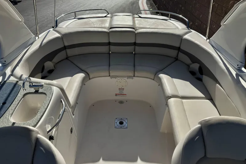 Slide: The Image of 2005 Chaparral 255 SSi boat interior with spacious seating and sink. - 12