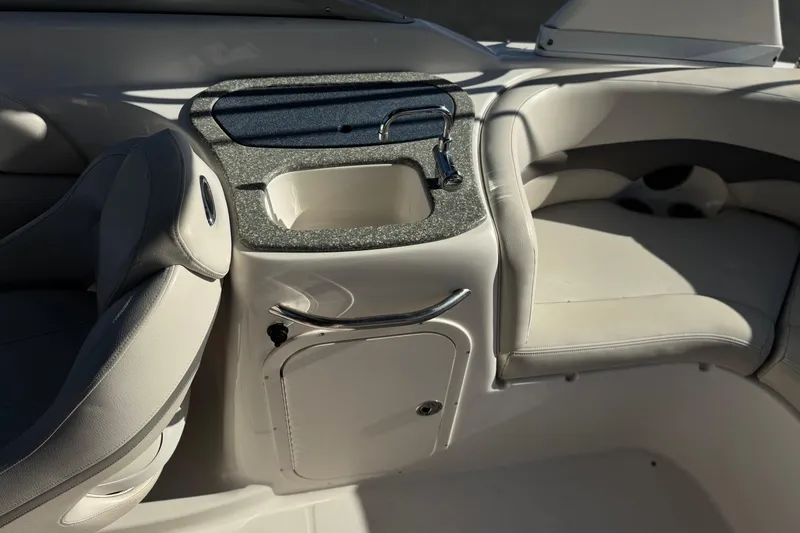 Slide: The Image of 2005 Chaparral 255 SSi boat interior with sink and seating area. - 13