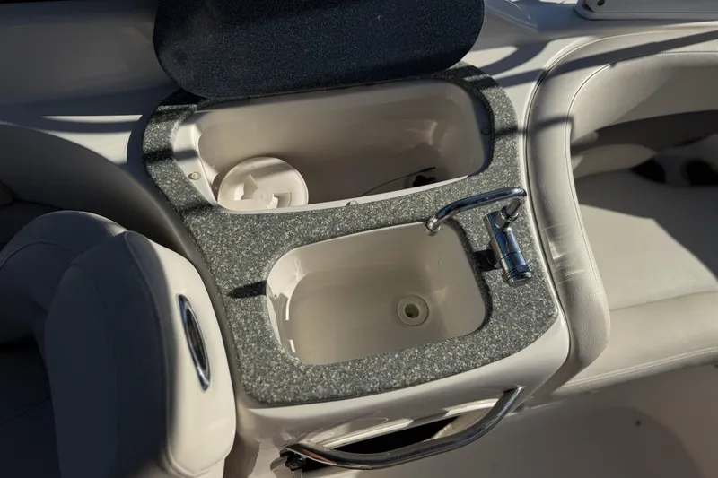 Slide: The Image of 2005 Chaparral 255 SSi boat interior with sink and faucet. - 15