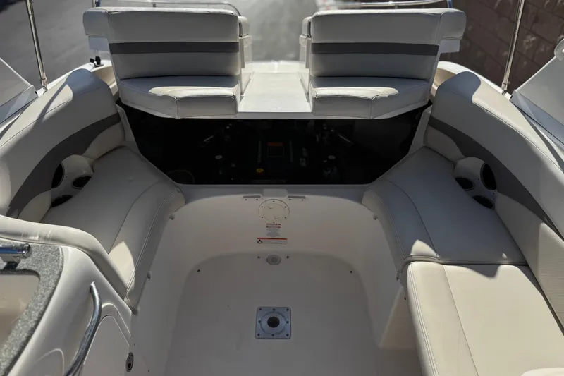 Slide: The Image of Interior of a 2005 Chaparral 255 SSi boat with cushioned seating. - 17