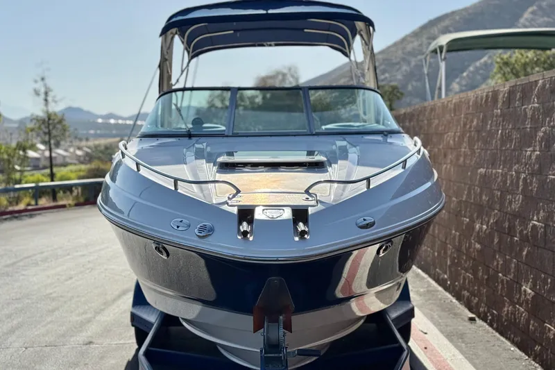 Slide: The Image of 2005 Chaparral 255 SSi boat on trailer, scenic mountain background. - 2