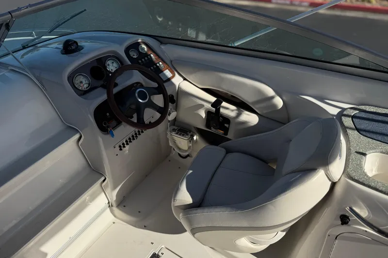 Slide: The Image of 2005 Chaparral 255 SSi boat interior with steering wheel and dashboard controls. - 21