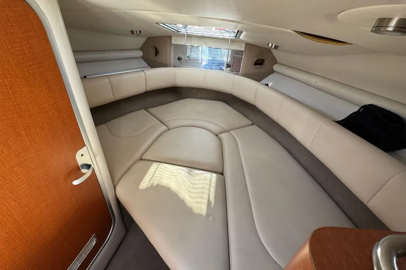 Slide: The Image of Interior cabin of a 2005 Chaparral 255 SSi boat with beige seating. - 27