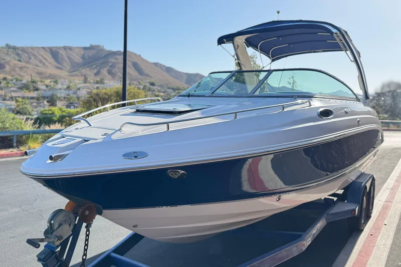 Slide: The Image of 2005 Chaparral 255 SSi boat on trailer, scenic mountain backdrop. - 3