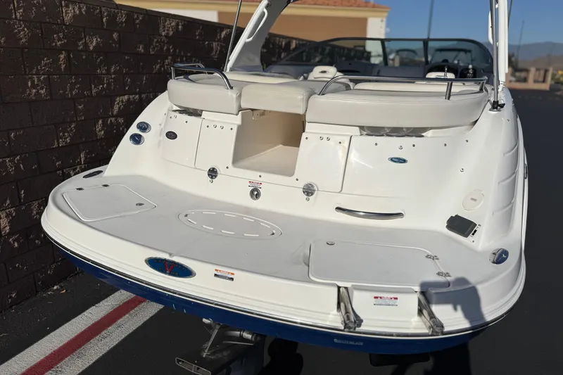 Slide: The Image of 2005 Chaparral 255 SSi boat rear view with swim platform and seating. - 6