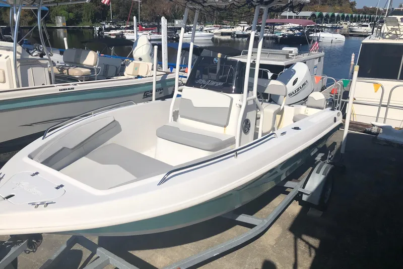 Slide: The Image of 2022 Key Largo 1800 Center Console boat on trailer at marina. - 10