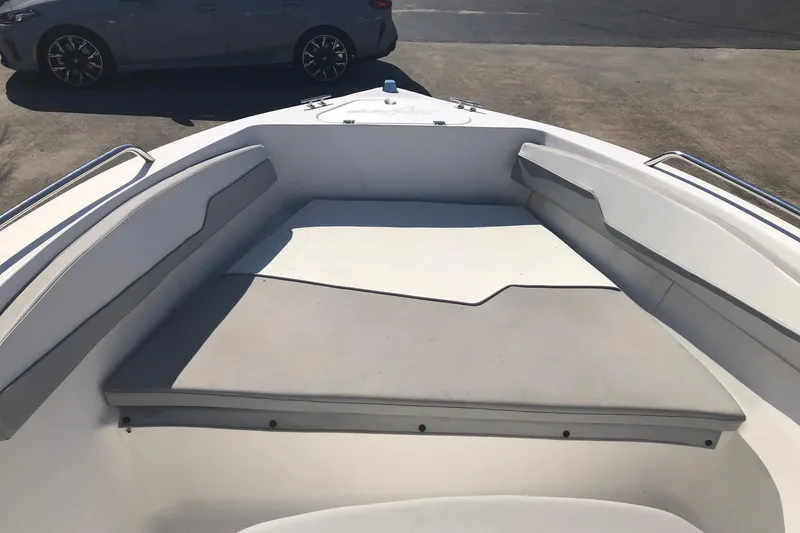Slide: The Image of 2022 Key Largo 1800 Center Console boat interior with cushioned seating area. - 12