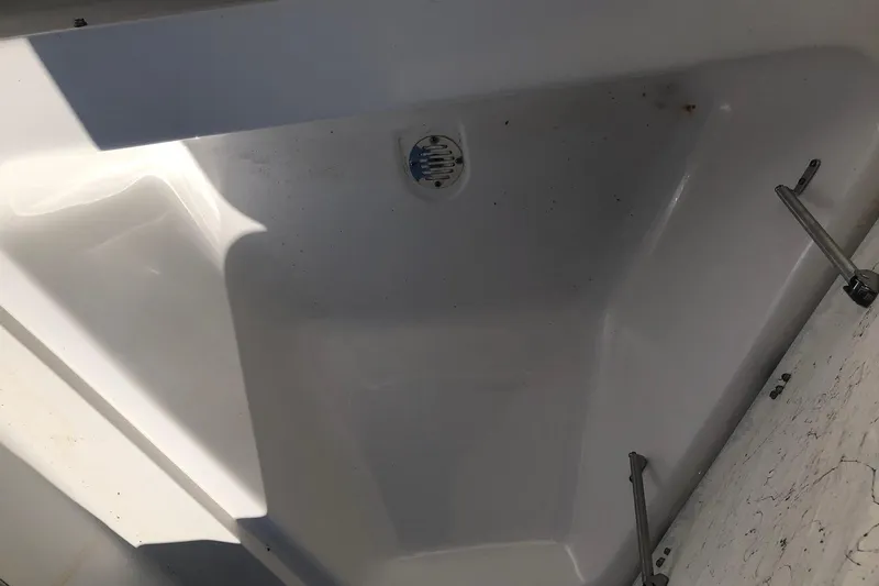 Slide: The Image of Clean white interior of 2022 Key Largo 1800 Center Console boat. - 13