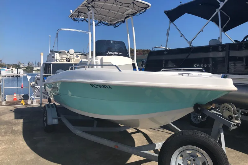 Slide: The Image of 2022 Key Largo 1800 Center Console boat on trailer at marina. - 3