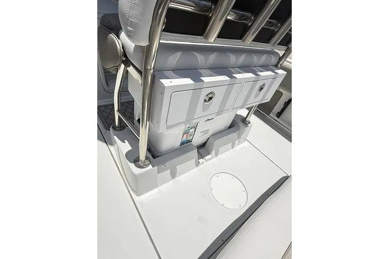 Slide: The Image of 2024 Finseeker 210 CC boat interior with storage compartments and stainless steel railings. - 10