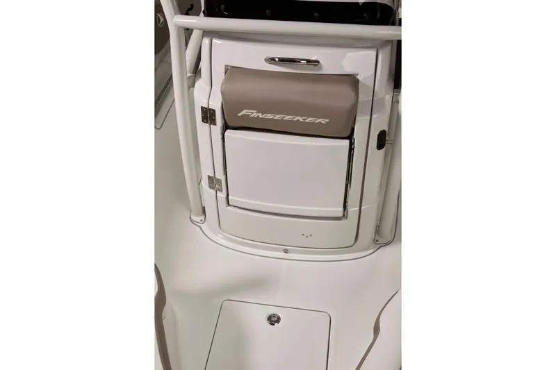Slide: The Image of 2024 Finseeker 210 CC boat console with storage compartment and sleek design. - 15
