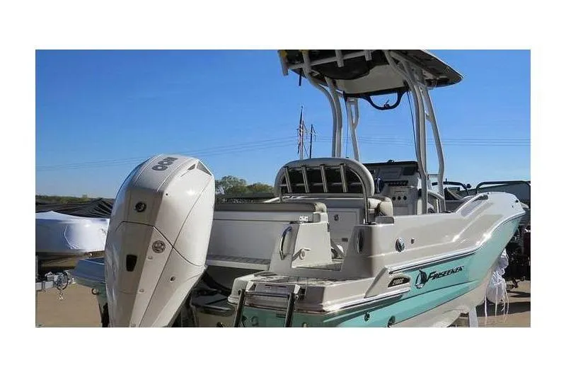 Slide: The Image of 2024 Finseeker 210 CC boat with outboard motor, viewed from the rear. - 3