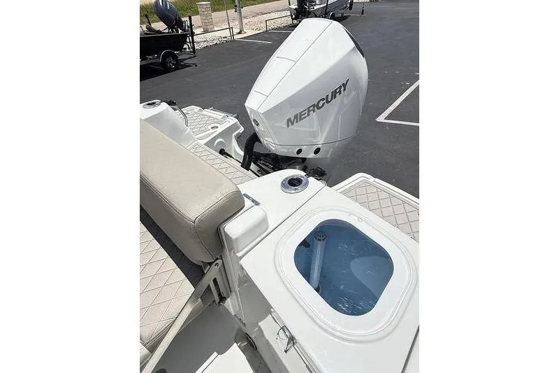 Slide: The Image of 2024 Finseeker 210 CC boat with Mercury engine and livewell on deck. - 7