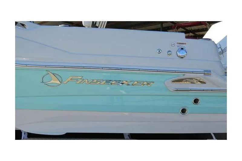 Slide: The Image of 2024 Finseeker 210 CC boat side view with logo and sleek design. - 8